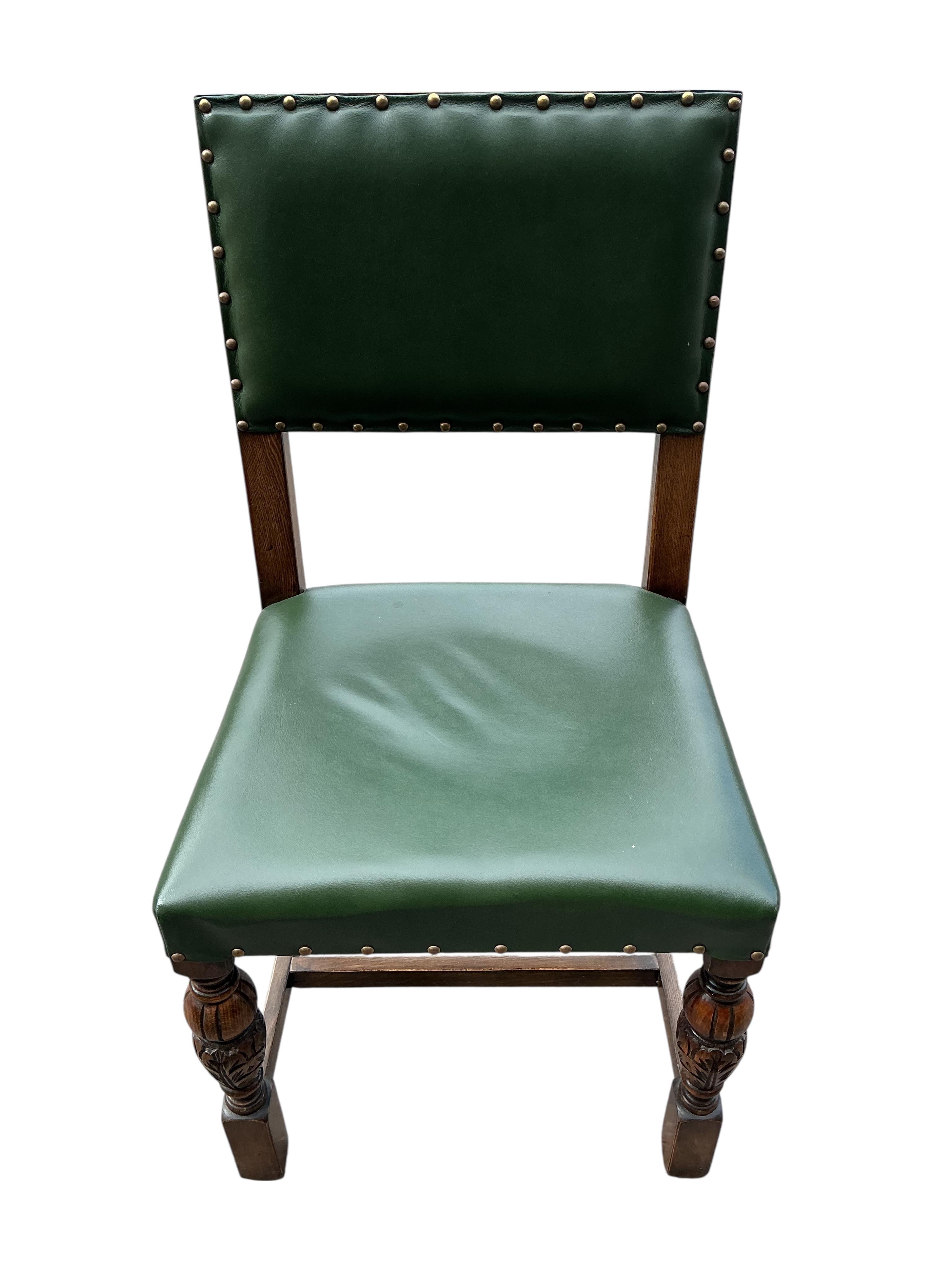 A set of twelve Bevan Funnel oak dining chairs, two with arms